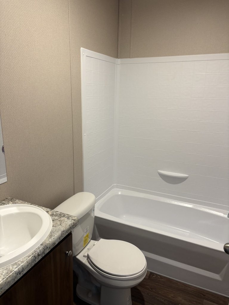 Bathroom with tub and shower surround
